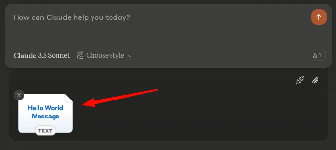 View of the Claude Desktop chat box, with an arrow pointing toward the “Hello World Message” attachment at the bottom left.