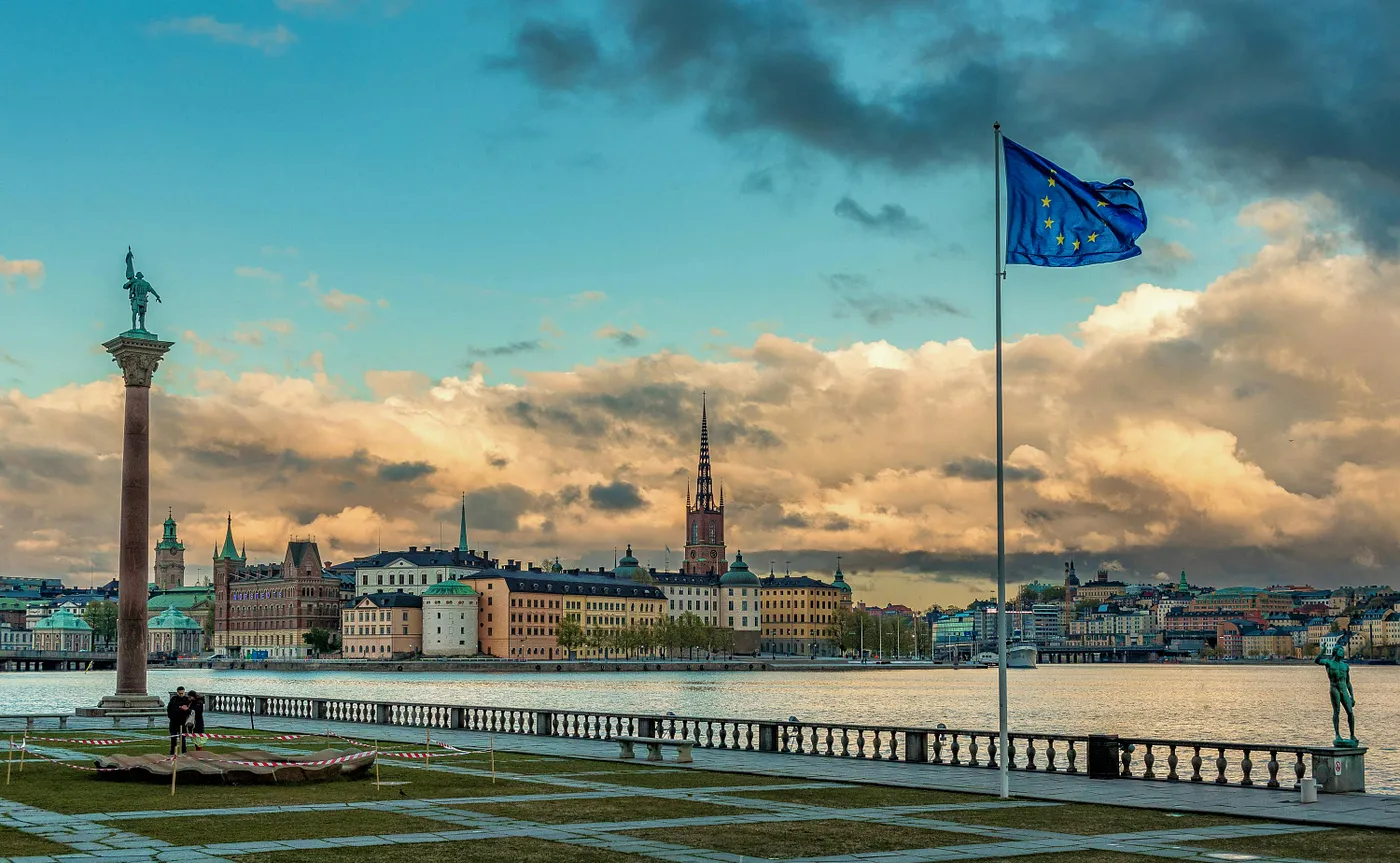 The flag of the European Union in front of a city view