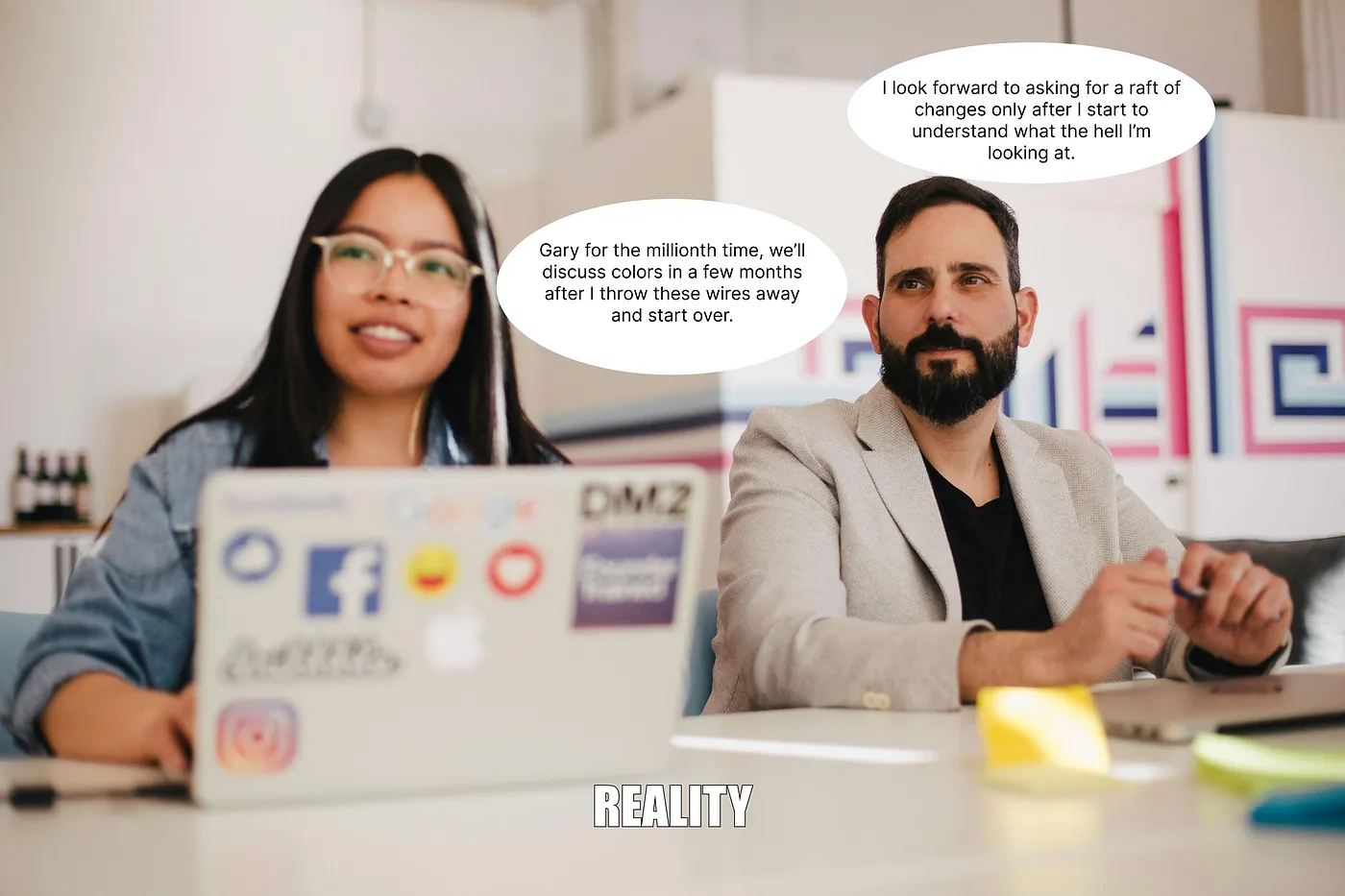 Man and woman behind a computer discussing a wireframe