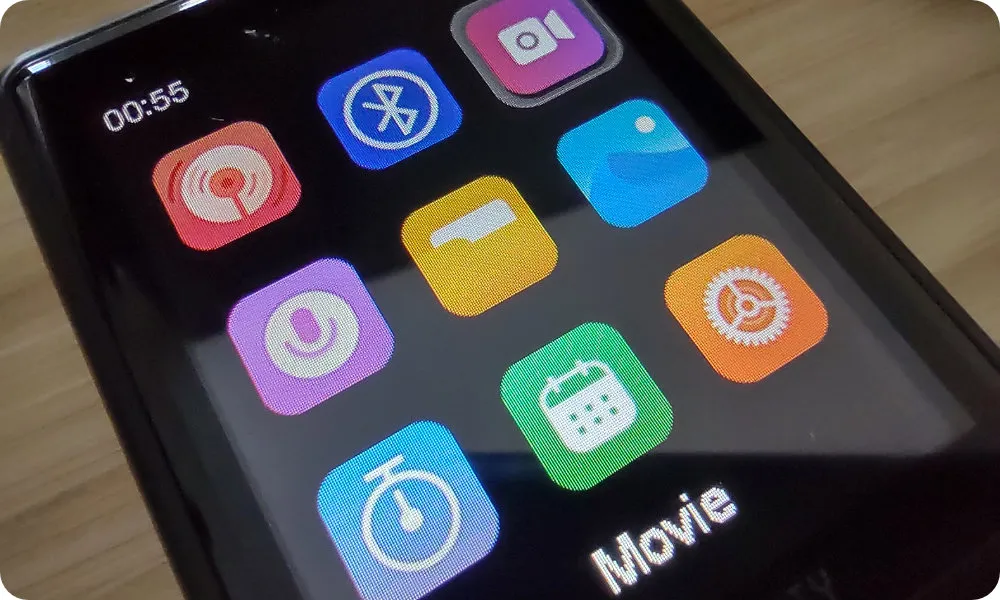 The main menu is displayed, a grid of 9 icons. The currently selected icon represents the “Movie” feature.